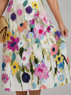 Flory | Vestido midi con estampado floral, sin mangas y cuello redondo